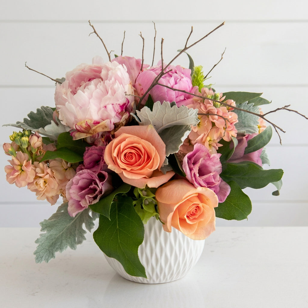 Peonies and peach roses vase