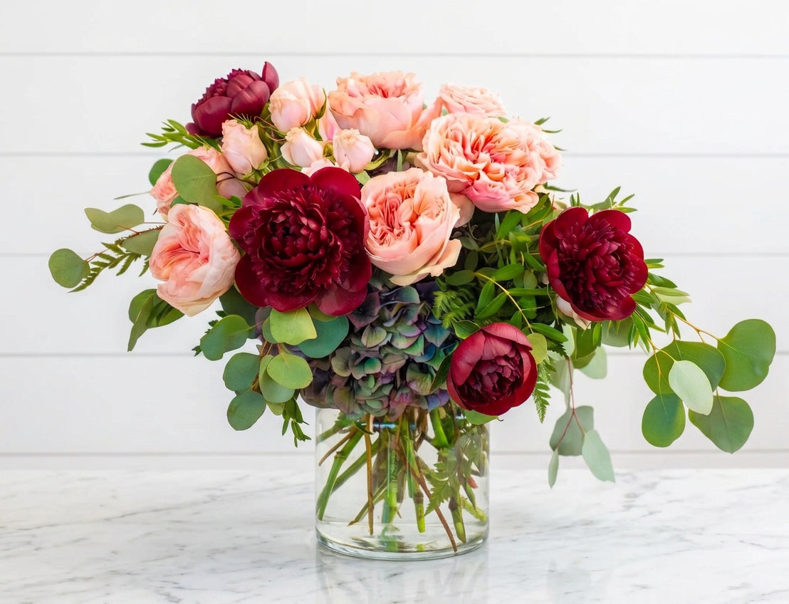 Peach garden roses and burgundy peonies