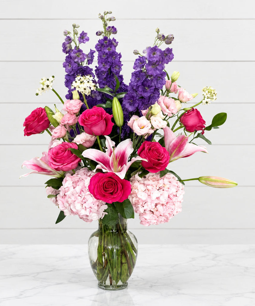 Pink and purple floral arrangement for birthdays.