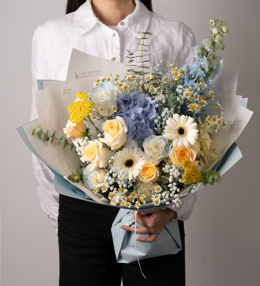 Blue yellow florals wrapped bouquet