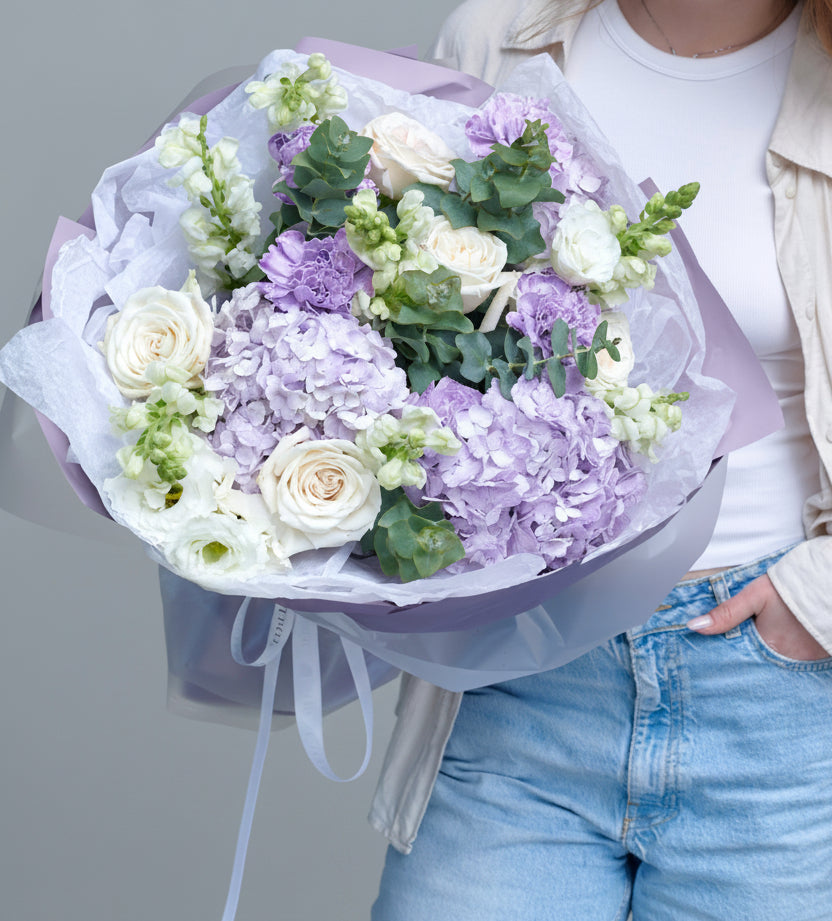 Purple white wrapped bouquet