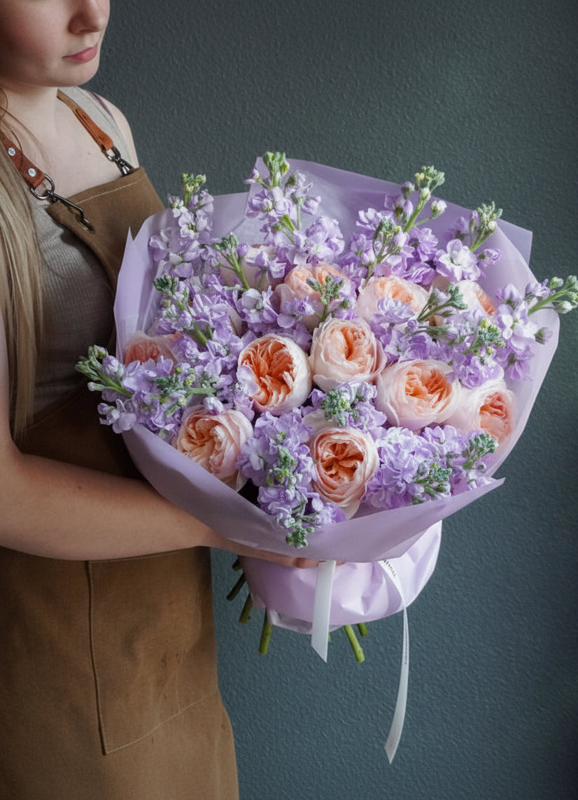 Peach garden rose lavebder floral wrapped bouquet 