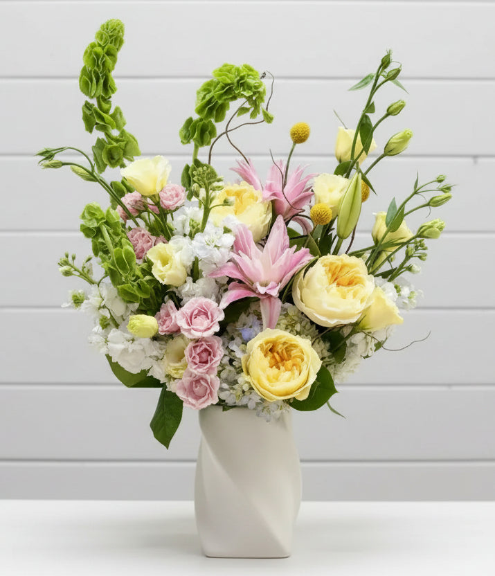Bouquet of flowers in a vase on a marble surface